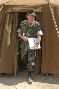 SHIMKUS Dr. Albert Shimkus, Commanding Officer of the Guantanamo Bay field hospital, leaves a tent after speaking to reporters at the US Navy Base at Guantanamo Bay, Cuba, on Thursday, Feb. 28, 2002. (Photo by Andres Leighton/AP)