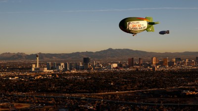 The Greenpeace A.E. Bates thermal airship flies over Las Vegas urging Hillary Clinton to reject fossil fuel money. The airship carries two messages, one which reads "Don't Gamble With Our Democracy" and a second message to Secretary Clinton urging her to "Say No To Fossil Fuel Money". (Photo: Steve Marcus/Greenpeace)