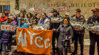 In time for Thanksgiving, members of New York Communities for Change, Strong Economy for All and other progressive advocacy groups delivered turkeys stuffed with cash to the 40 Wall Street Trump Building on Nov. 22, 2017, to highlight how Trump's tax plan will take massive sums of money from working people to benefit the richest Americans. (Photo by Erik McGregor/Pacific Press/LightRocket via Getty Images)
